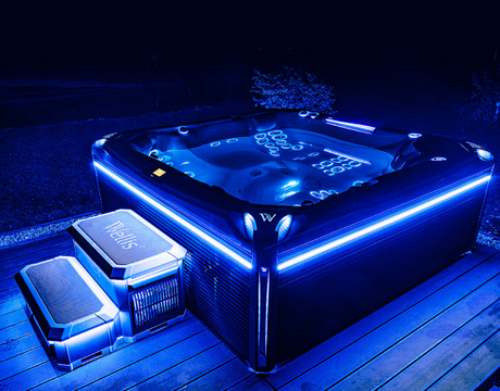 Wellis hot tub showcasing LED lights at night